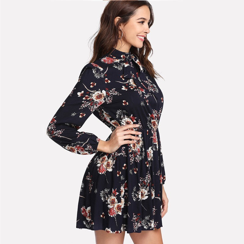 Woman wearing a floral dress on a white background