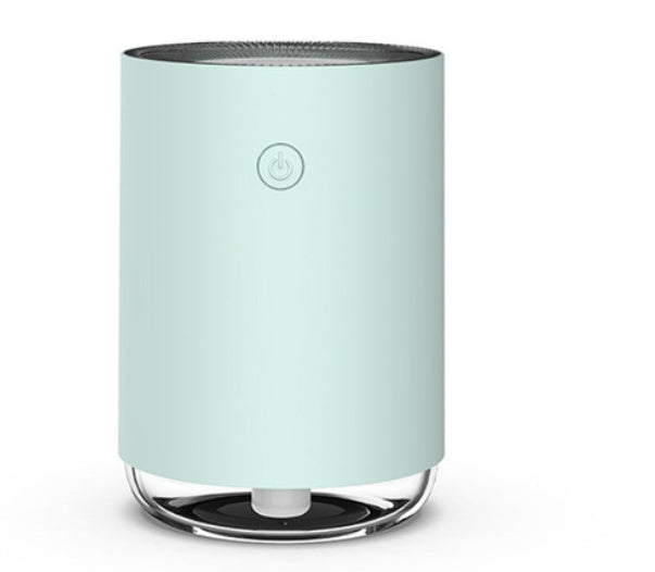 Mint green air purifier on a white background