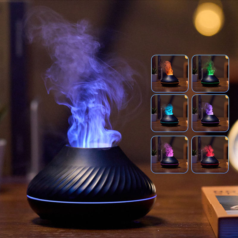 Black essential oil diffuser with colorful lights on a wooden surface