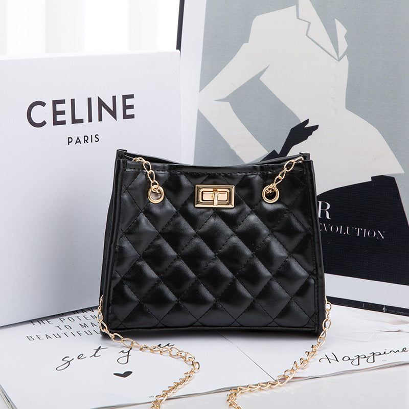 Black quilted handbag with gold chain on a magazine background featuring Celine branding.