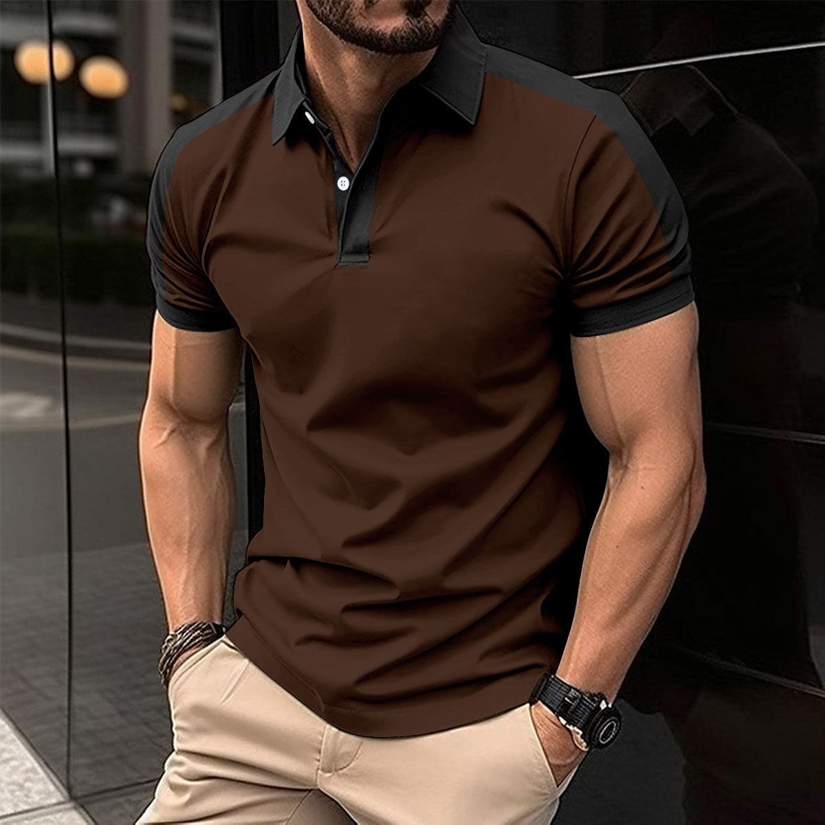Man wearing a brown polo shirt with black accents in an urban setting
