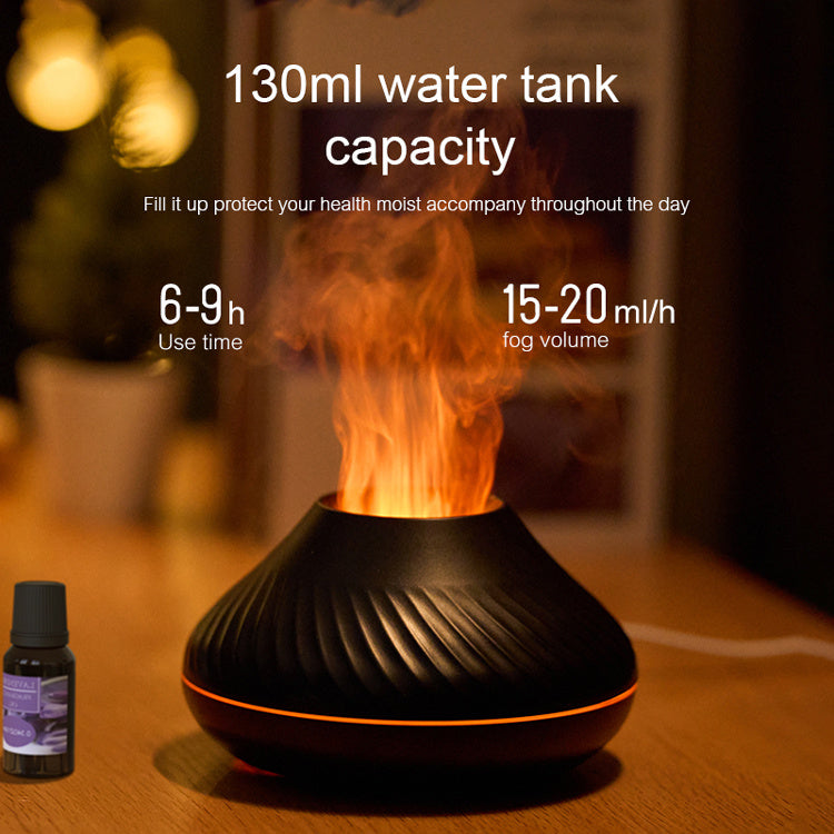 Black essential oil diffuser with flames on a wooden surface, showing water tank capacity and usage details.