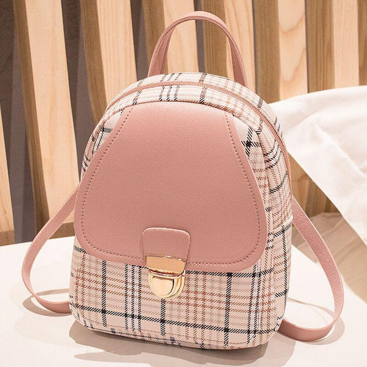 Pink and plaid backpack on a light background
