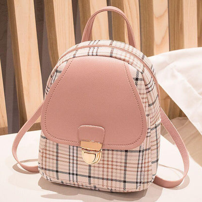 Pink and plaid backpack on a light background