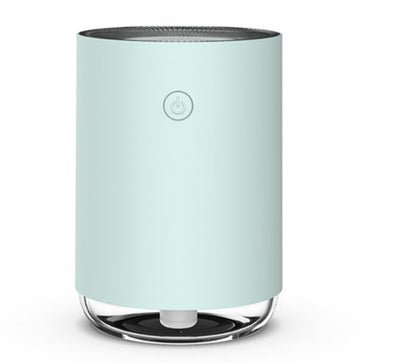 Mint green air purifier on a white background